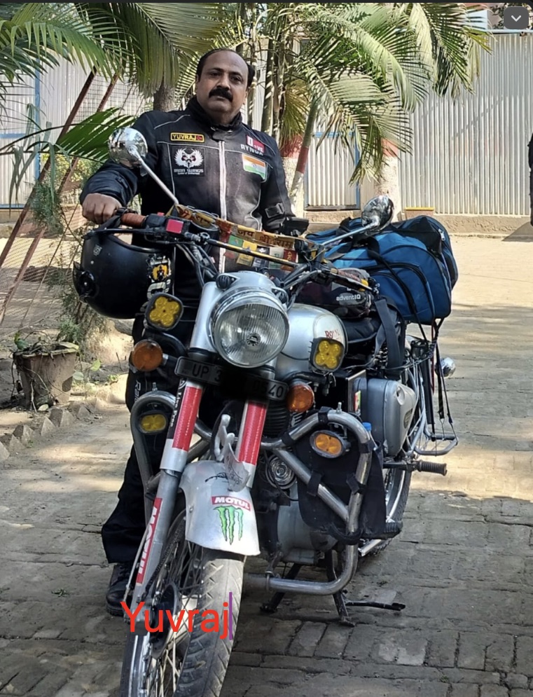 Iron Wings rider standing with touring motorcycle